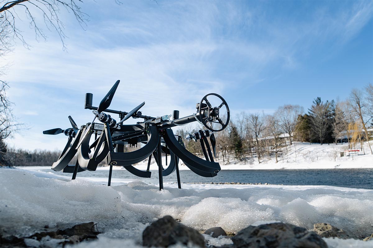 Skygauge inspection drone posed on snow by a river